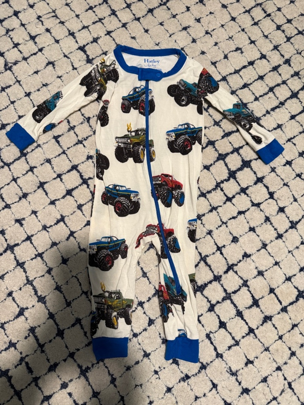 Hatley White Footie with Blue Trim and Multicolor Monster Trucks
